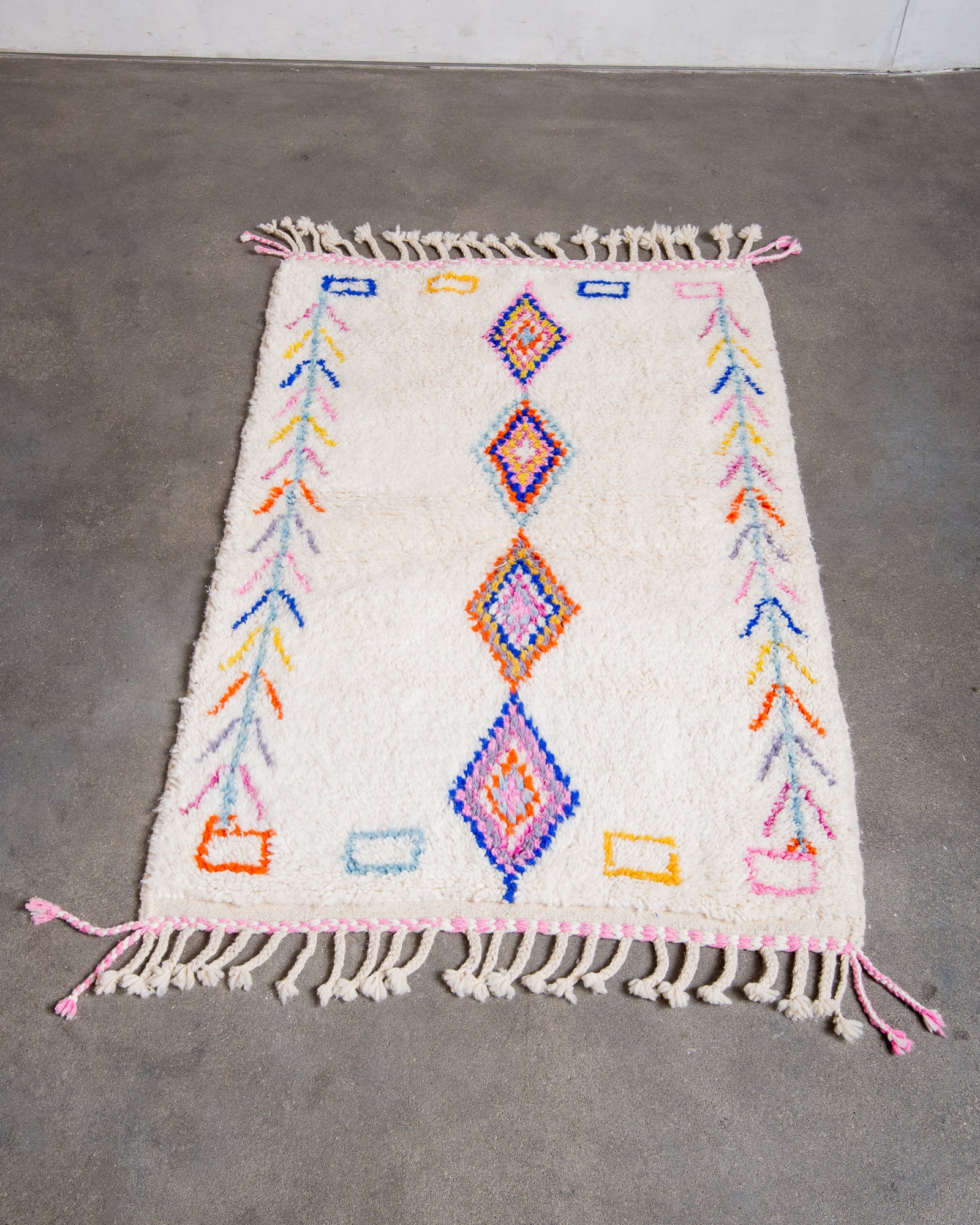 Modern, designer, handcrafted Berber rug from Morocco. Beniourain carpet with beautiful colours and patterns and fluffy wool texture.